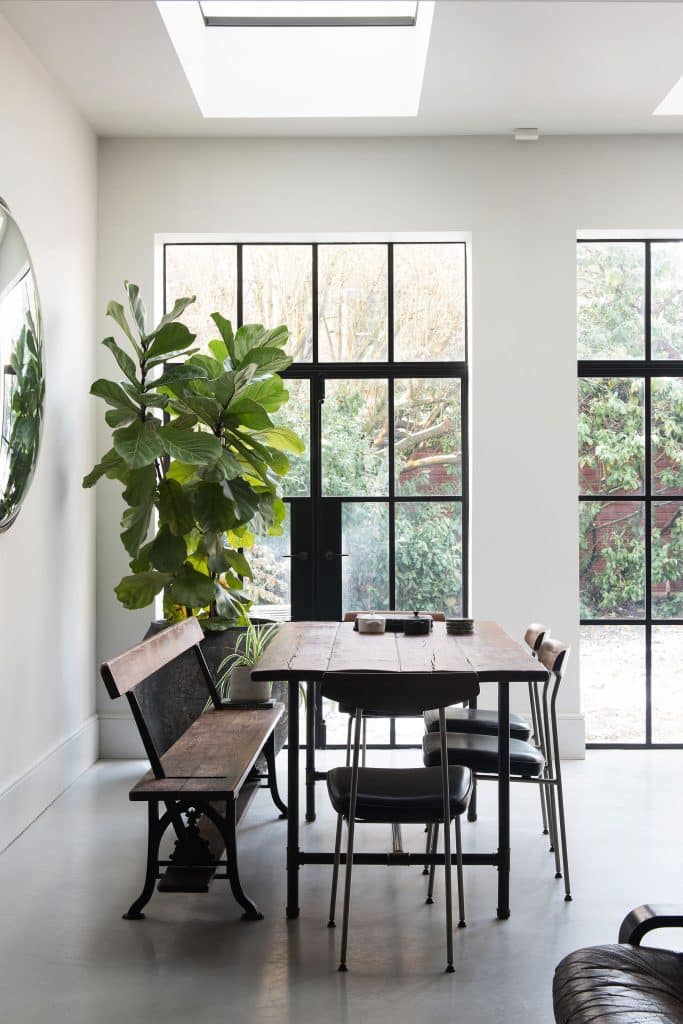 a living room filled with furniture and a large window