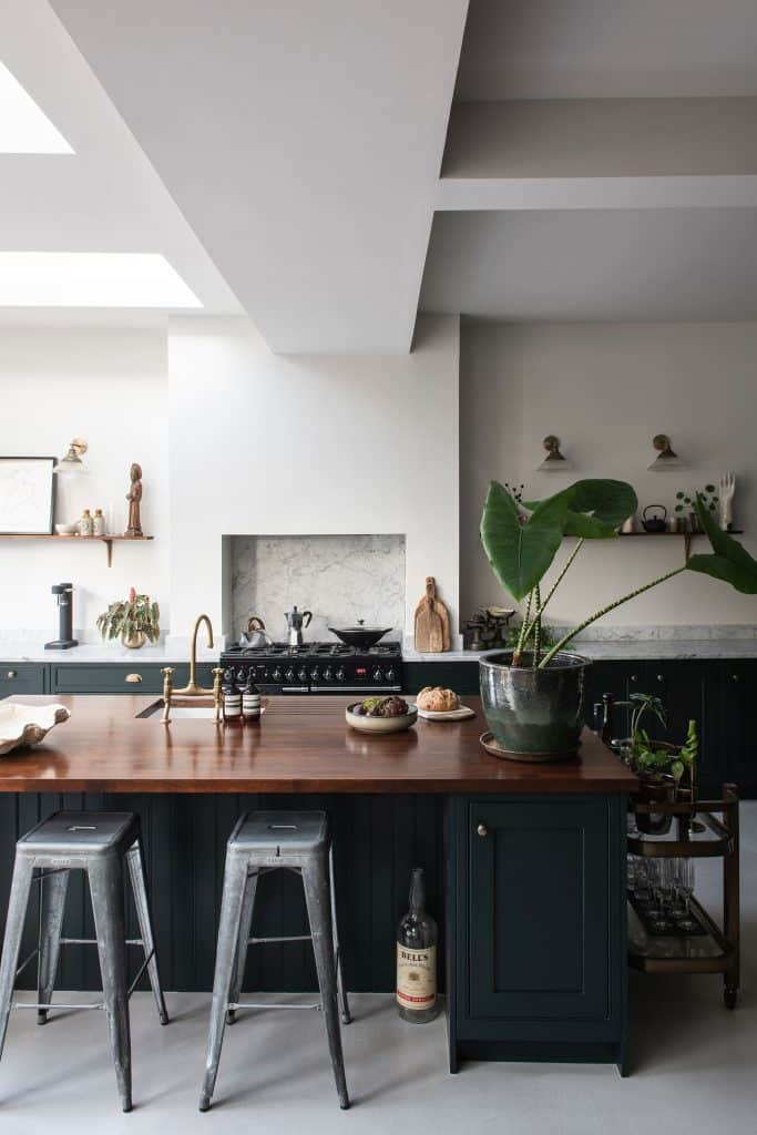 a kitchen with an island in the middle of a room