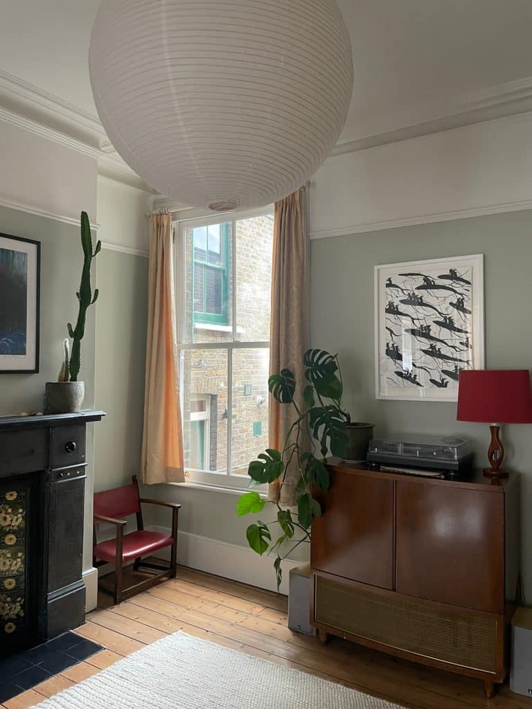 a living room filled with furniture and a large window