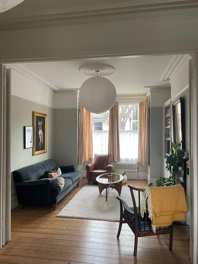 a living room filled with furniture and a large window