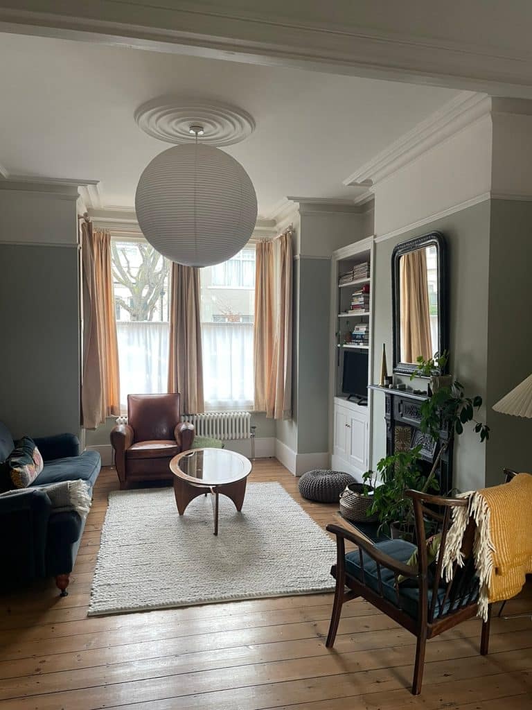 a living room filled with furniture and a large window