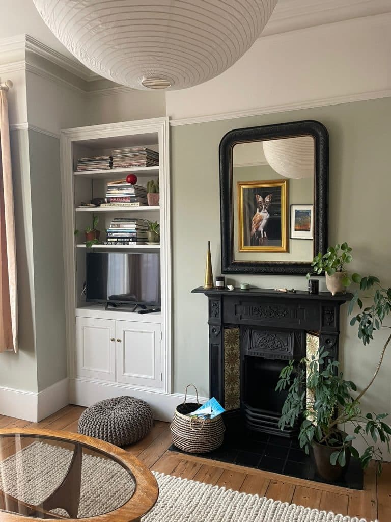 a living room filled with furniture and a fireplace