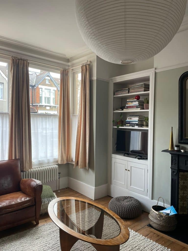 a living room filled with furniture and a large window