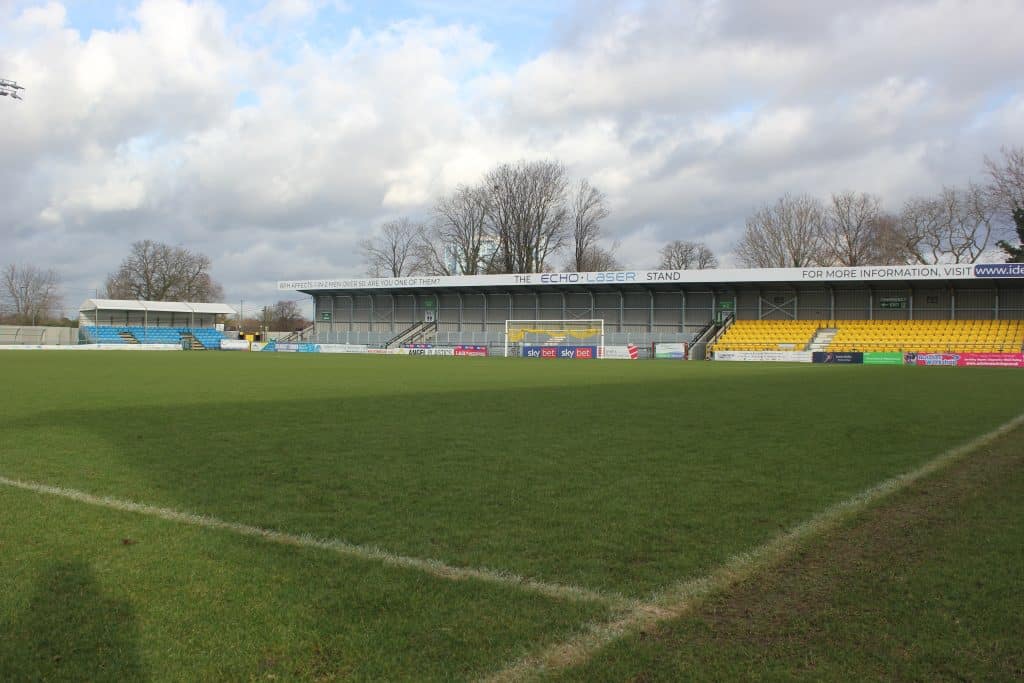 a large stadium with green grass