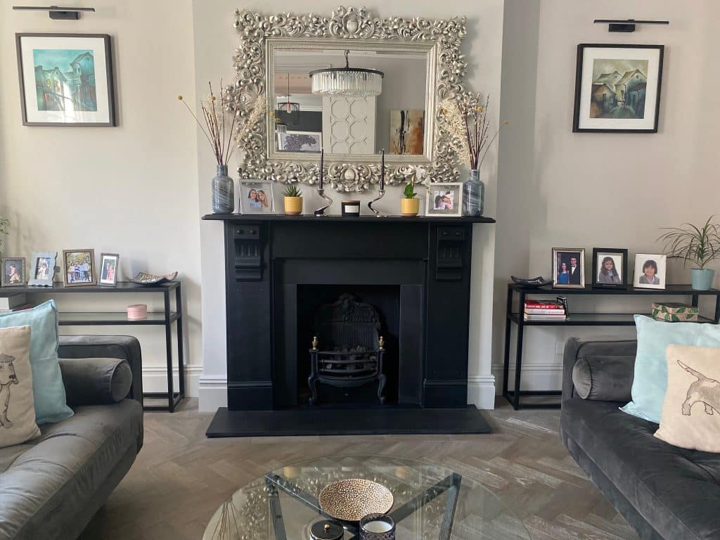 a living room filled with furniture and a fire place