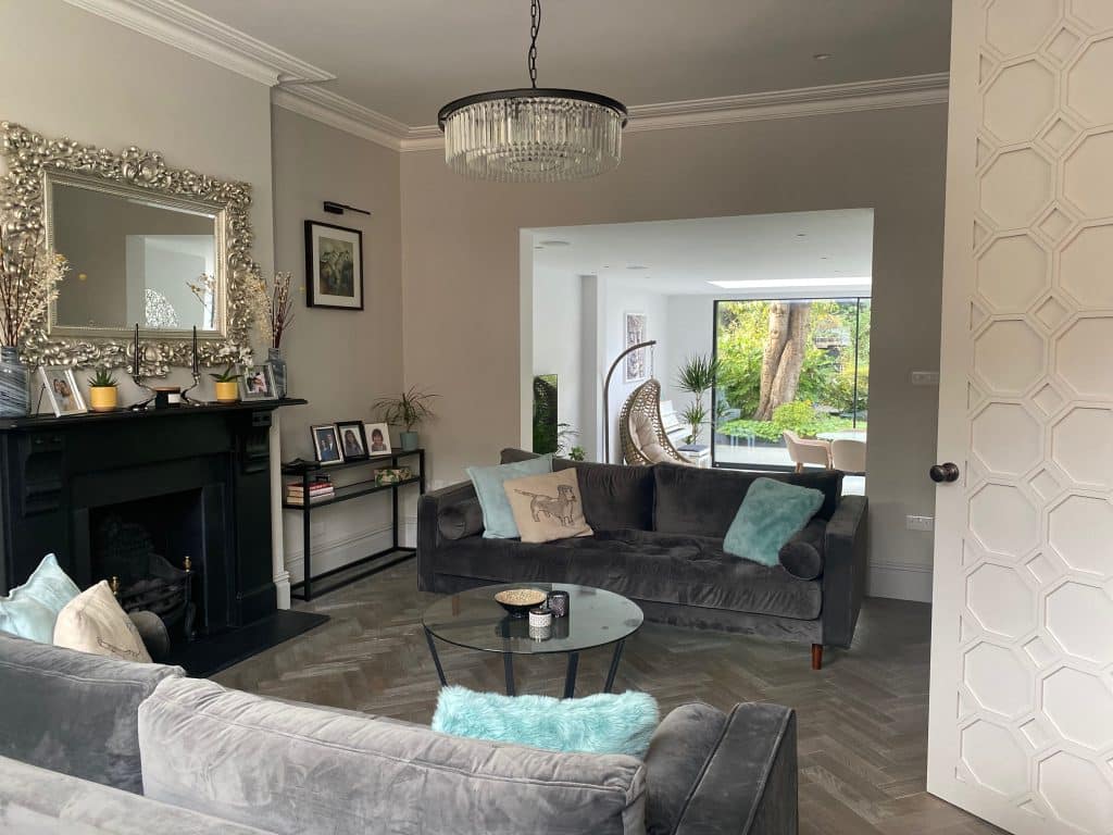 a living room filled with furniture and a fireplace