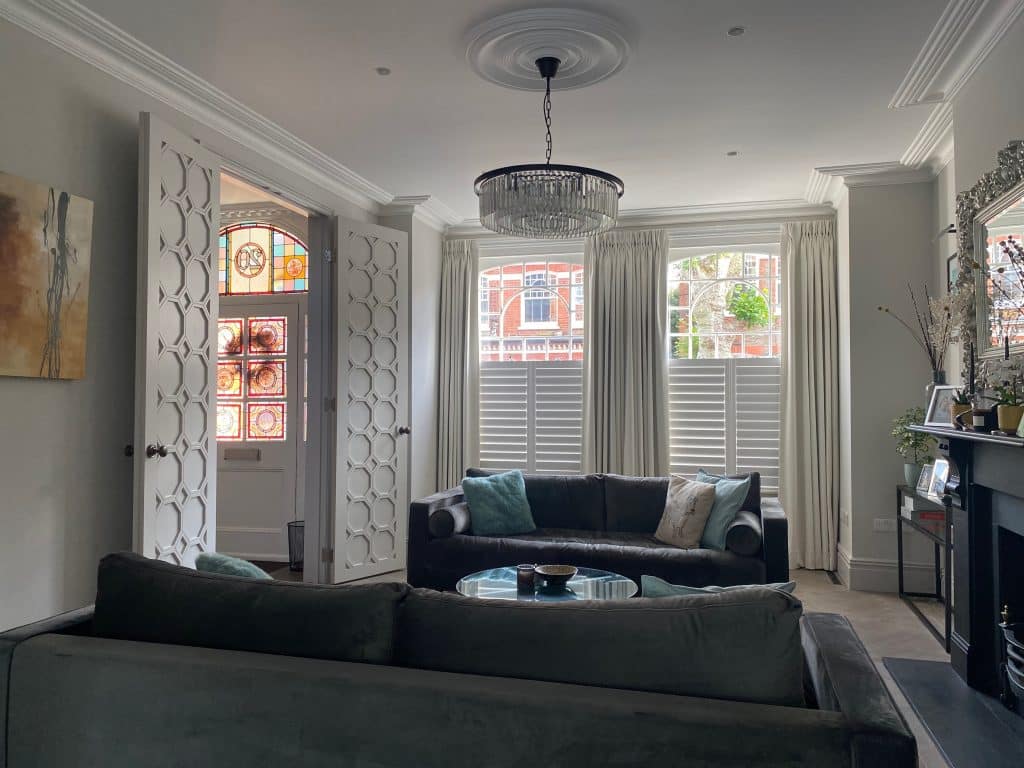 a living room filled with furniture and a large window
