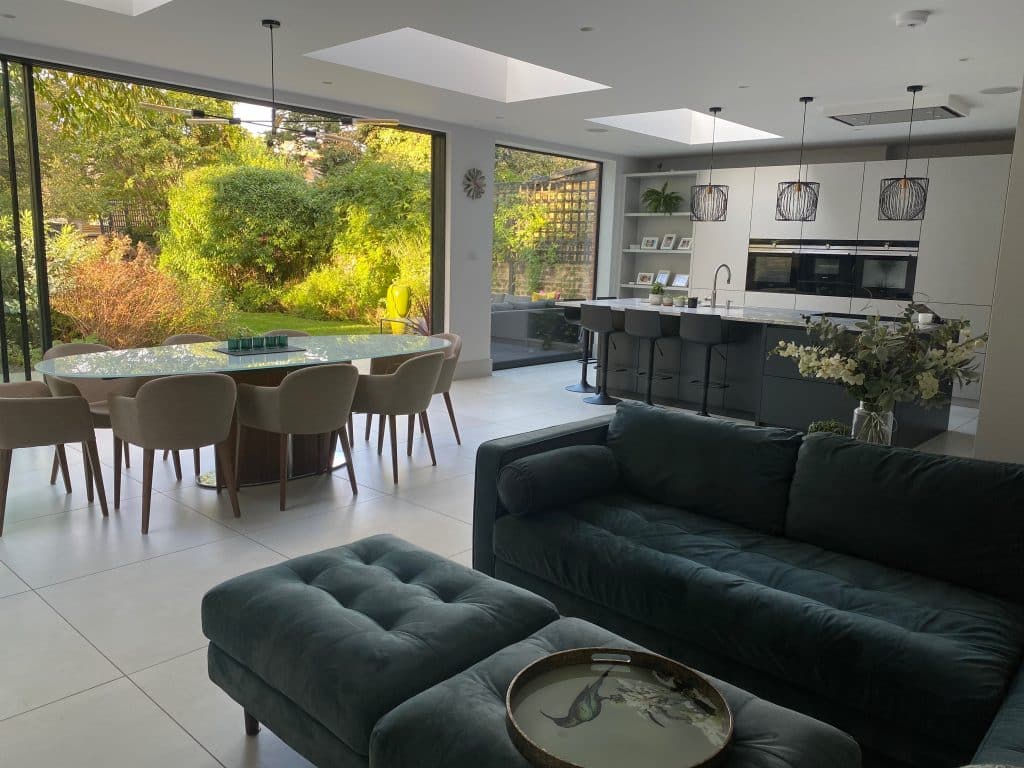 a living room filled with furniture and a large window