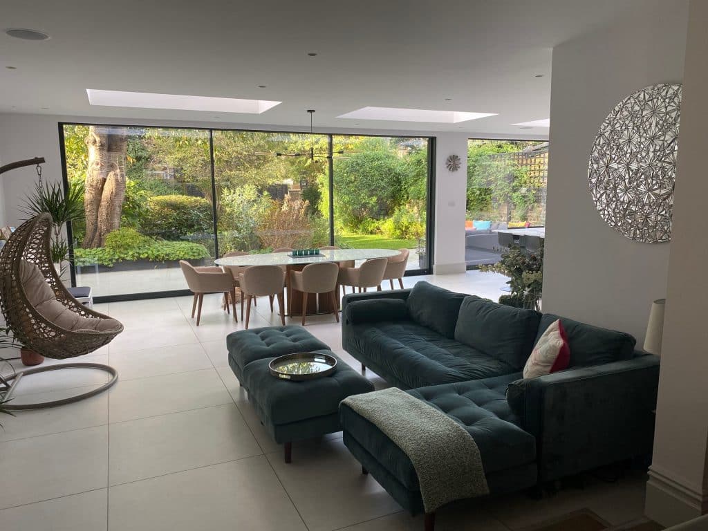 a living room filled with furniture and a large window