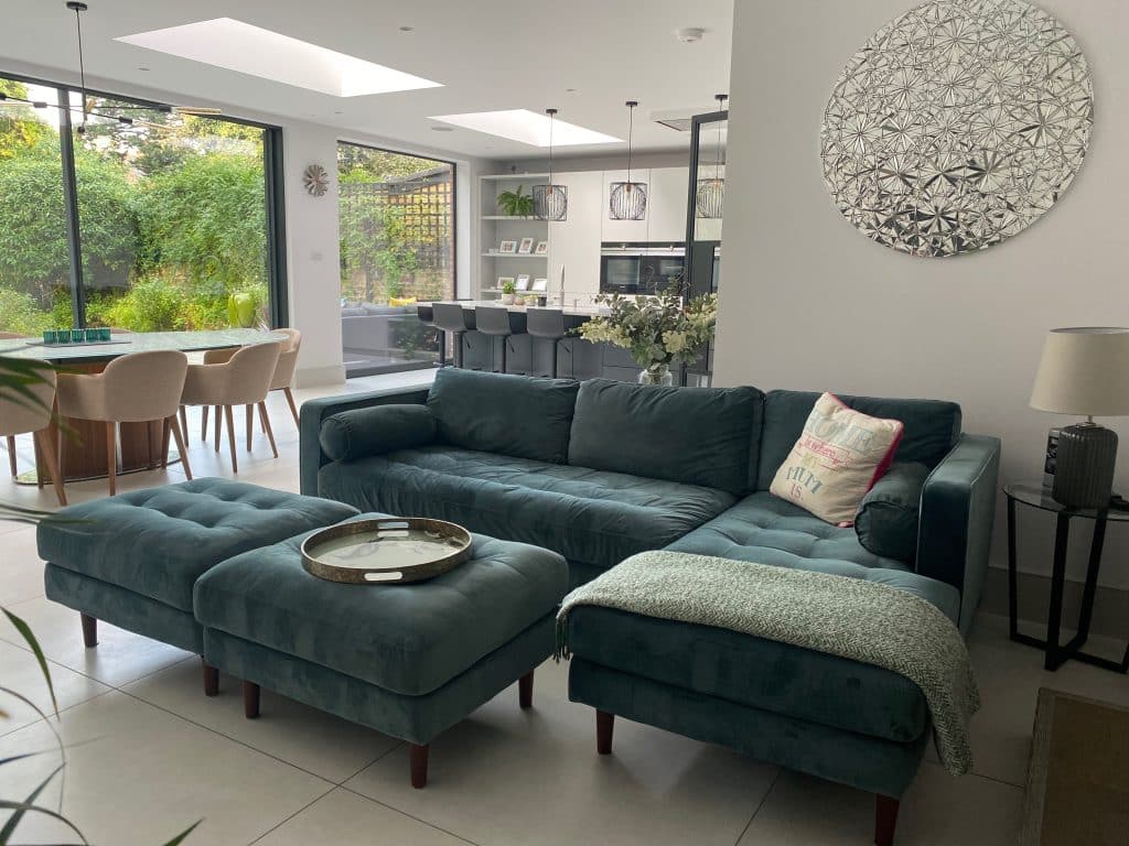 a living room filled with furniture and a large window