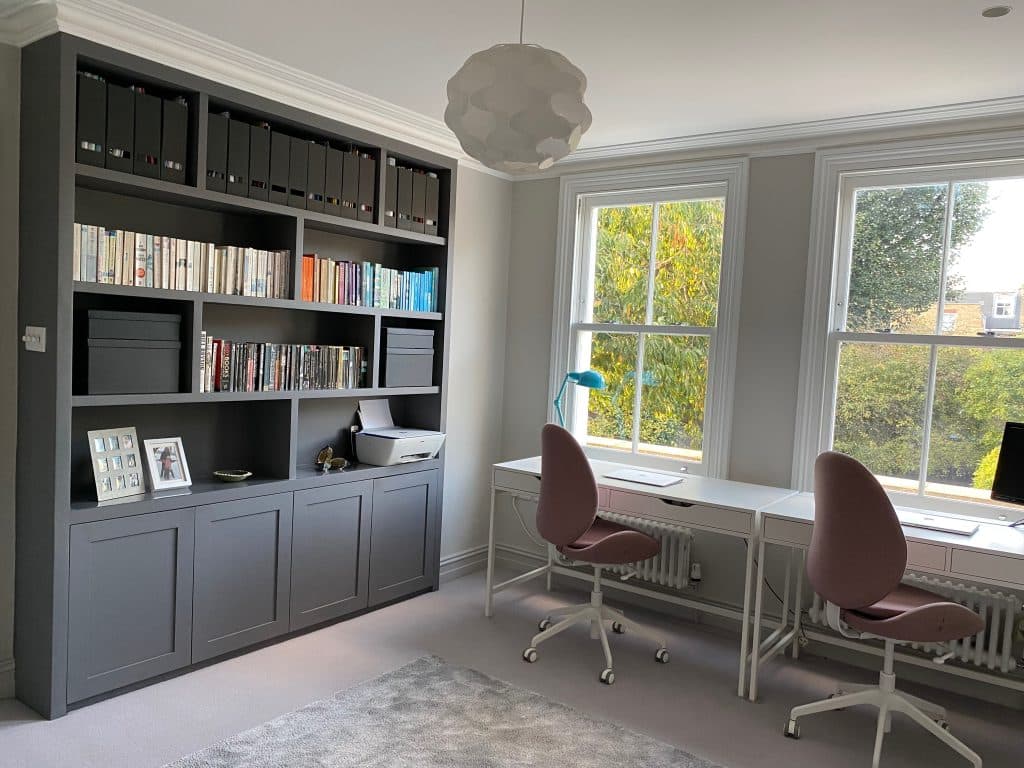 a living room filled with furniture and a large window