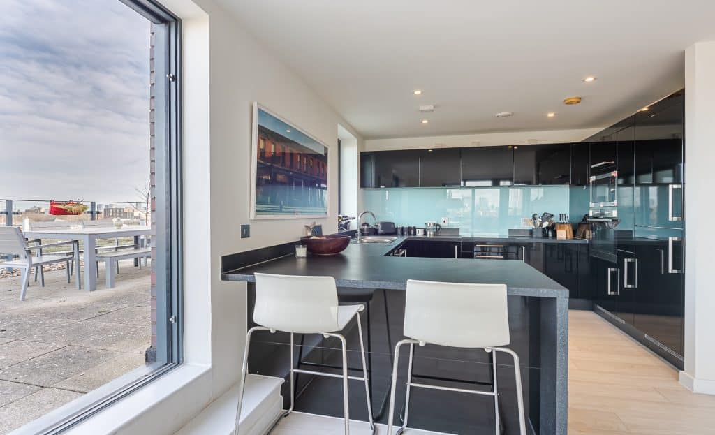 a living room filled with furniture and a large window