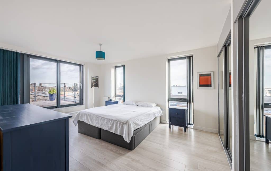 a bedroom with a large bed in a room