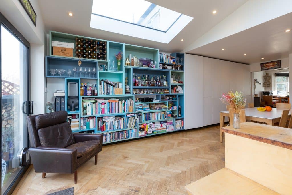 a living room filled with furniture and a large window