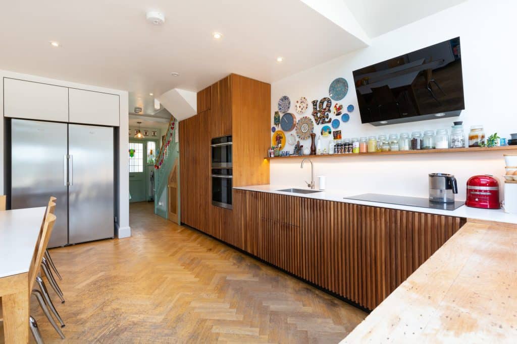 a kitchen with an island in the middle of a room