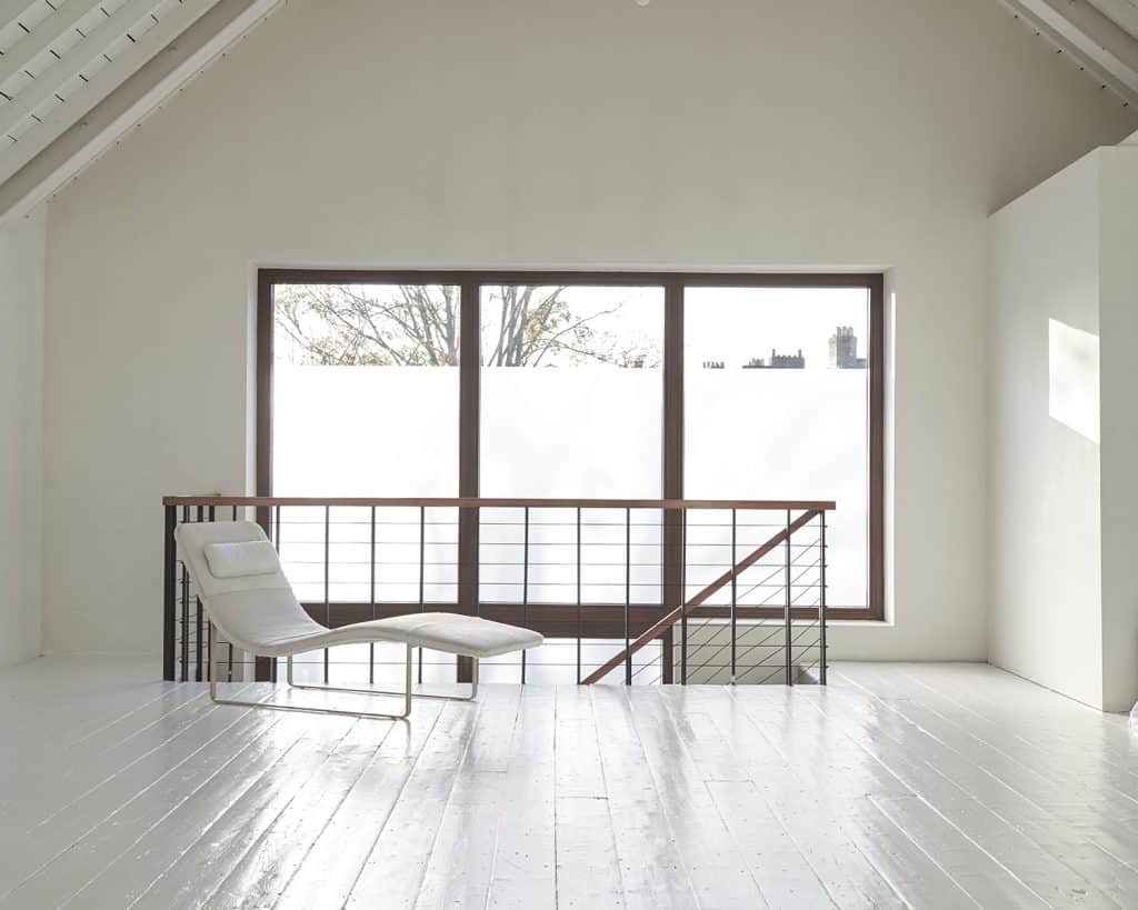 a room with a bed and a window
