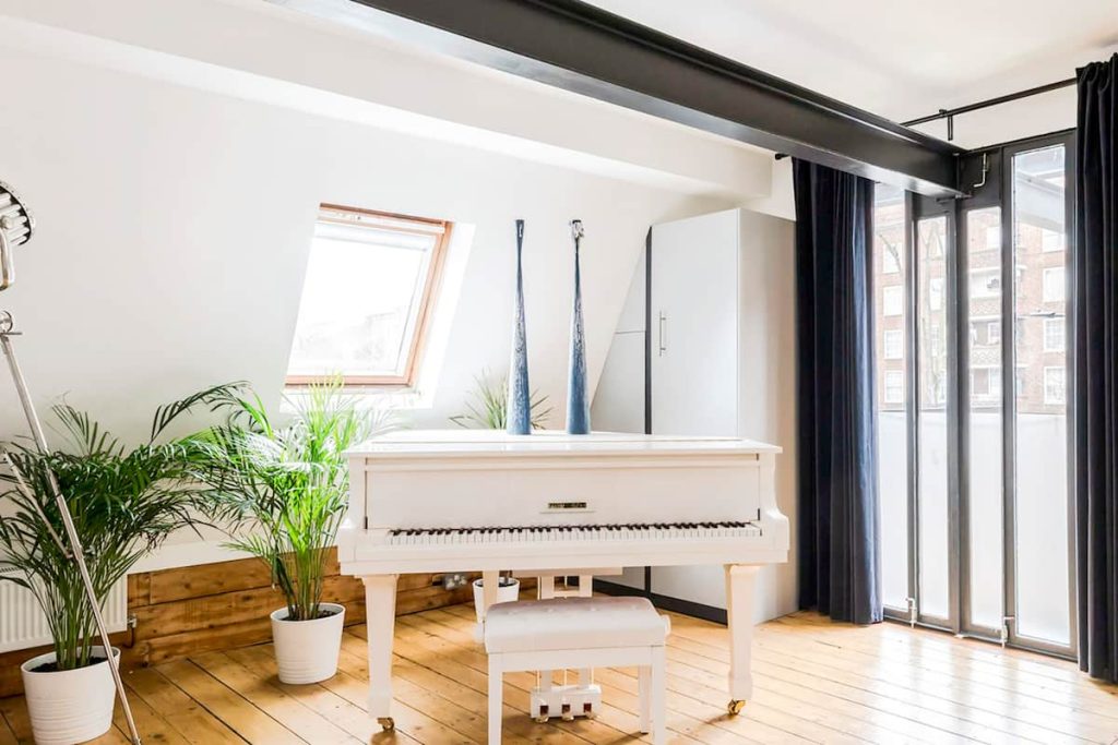 a room filled with furniture and a large window