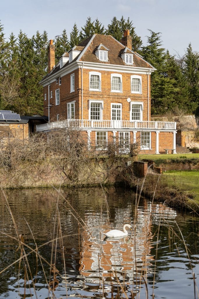 a building next to a body of water
