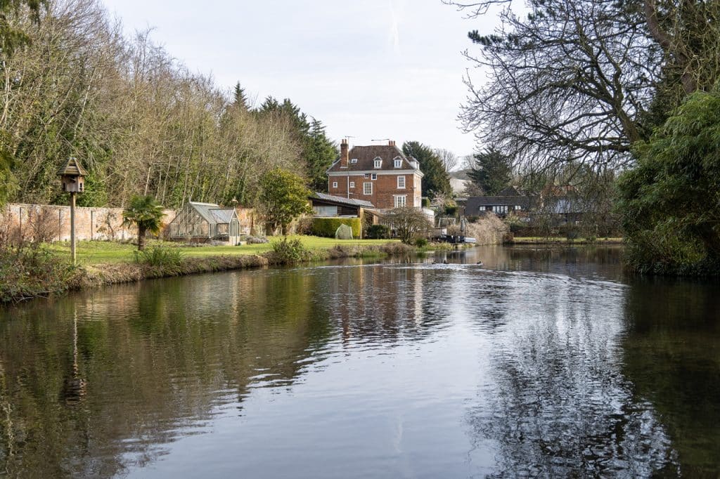 a small house in a body of water