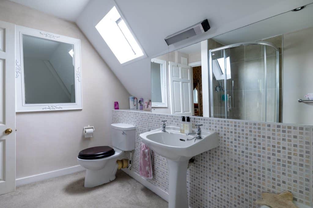 a room with a sink and a mirror