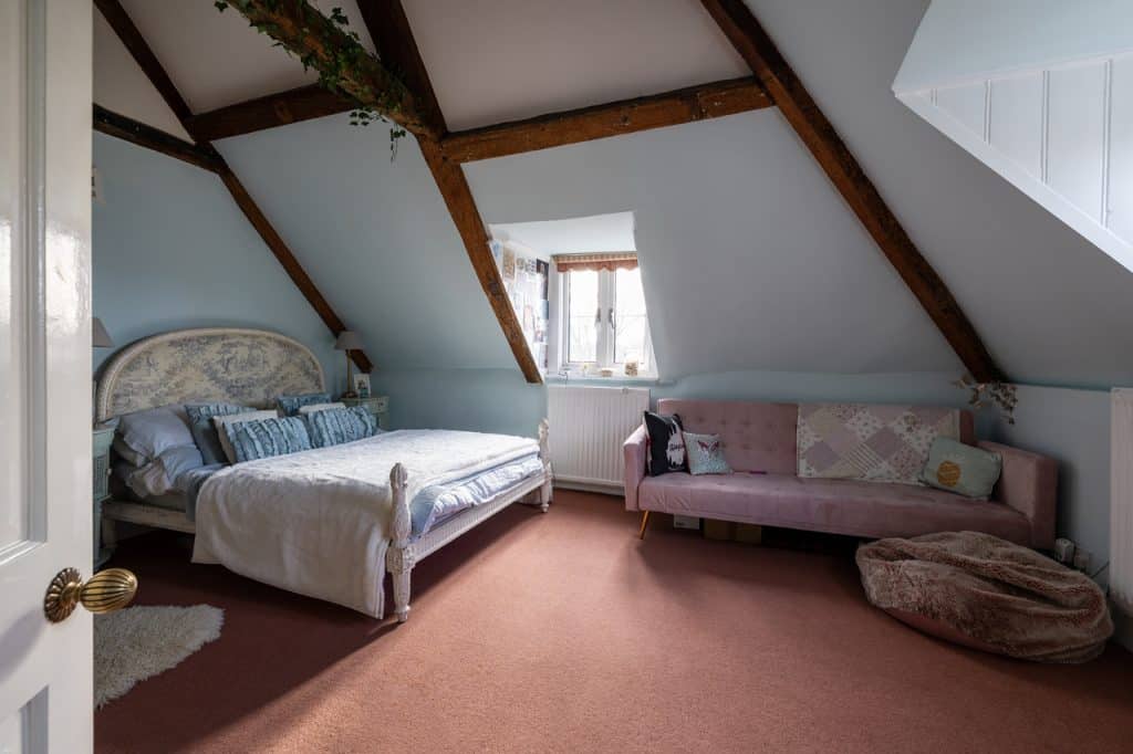 a bedroom with a bed in a room