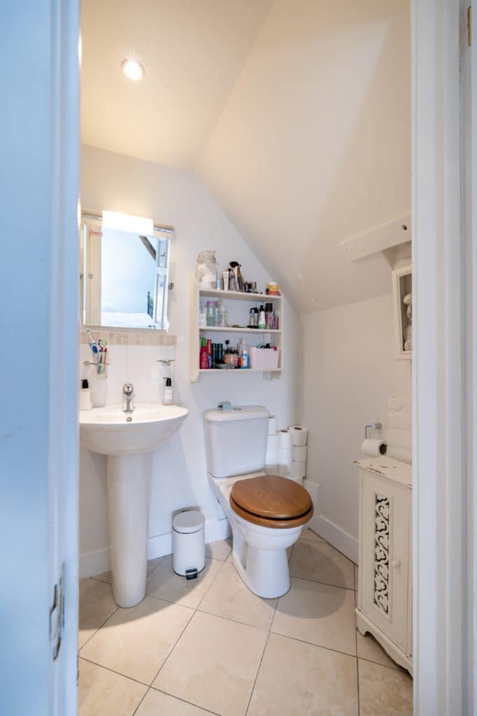 a room with a sink and a mirror