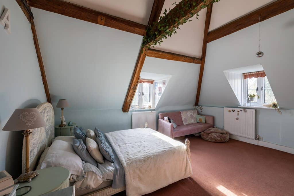 a bedroom with a bed in a room