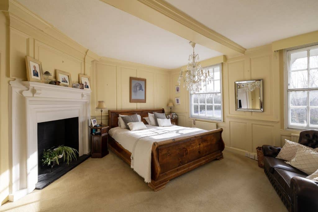 a bedroom with a large bed in a room