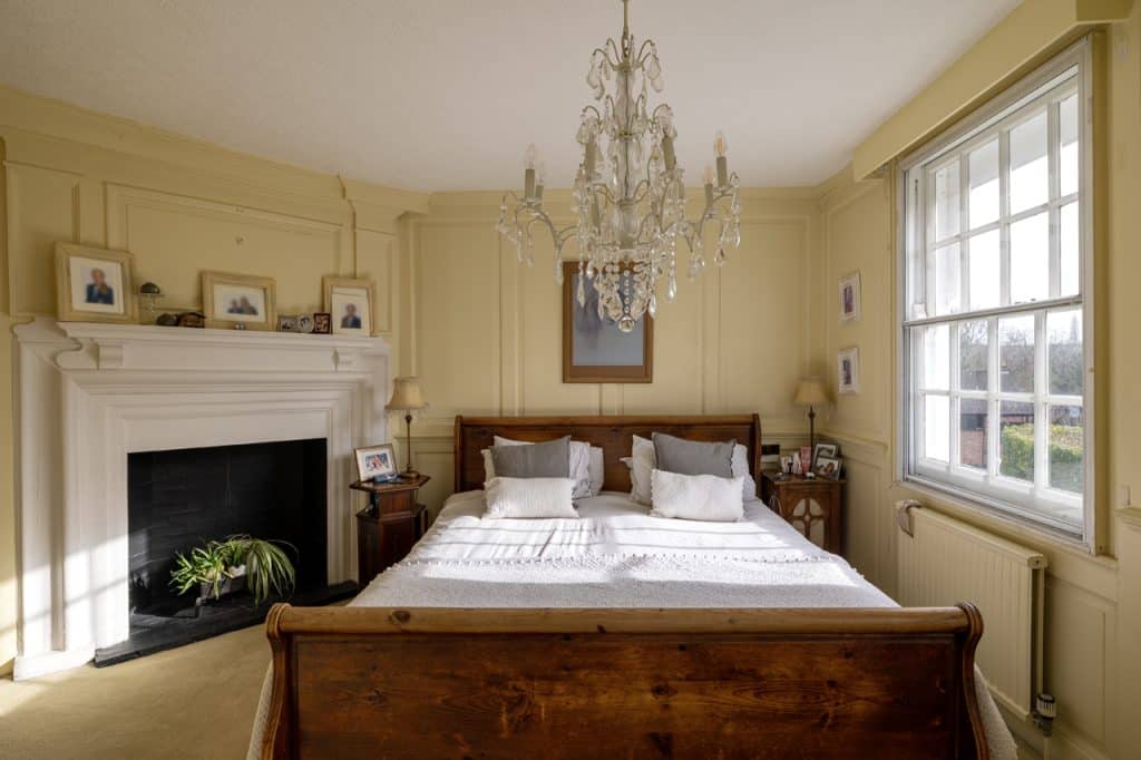 a bedroom with a large window