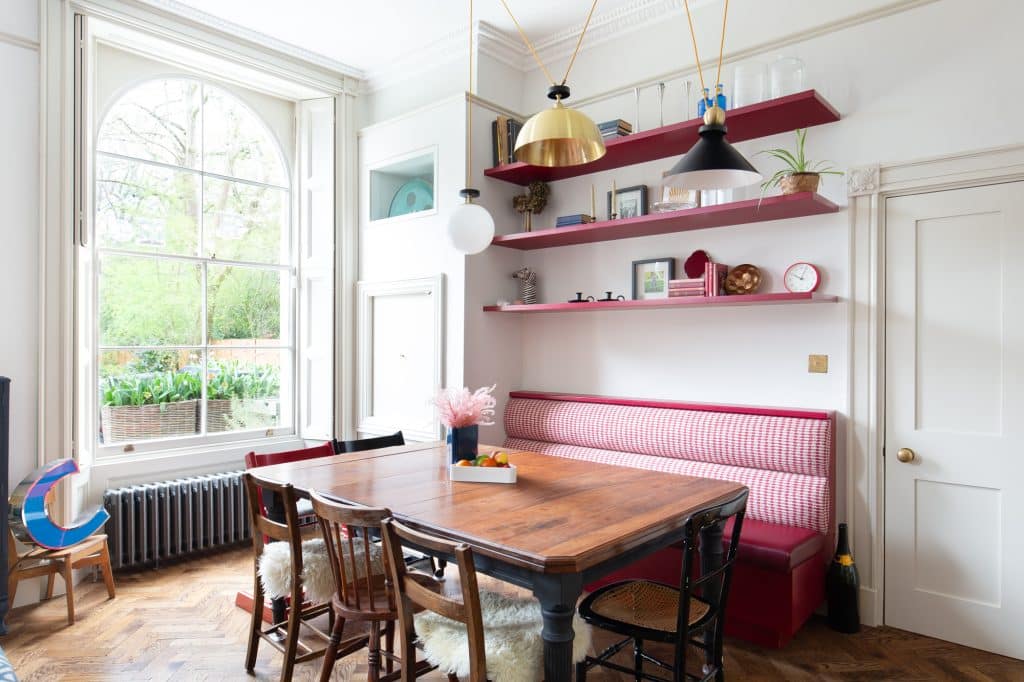 a dining room table in front of a window