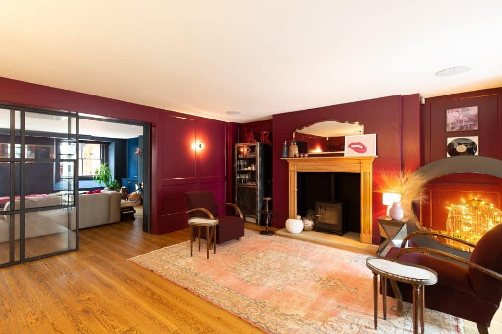 a living room filled with furniture and a fireplace