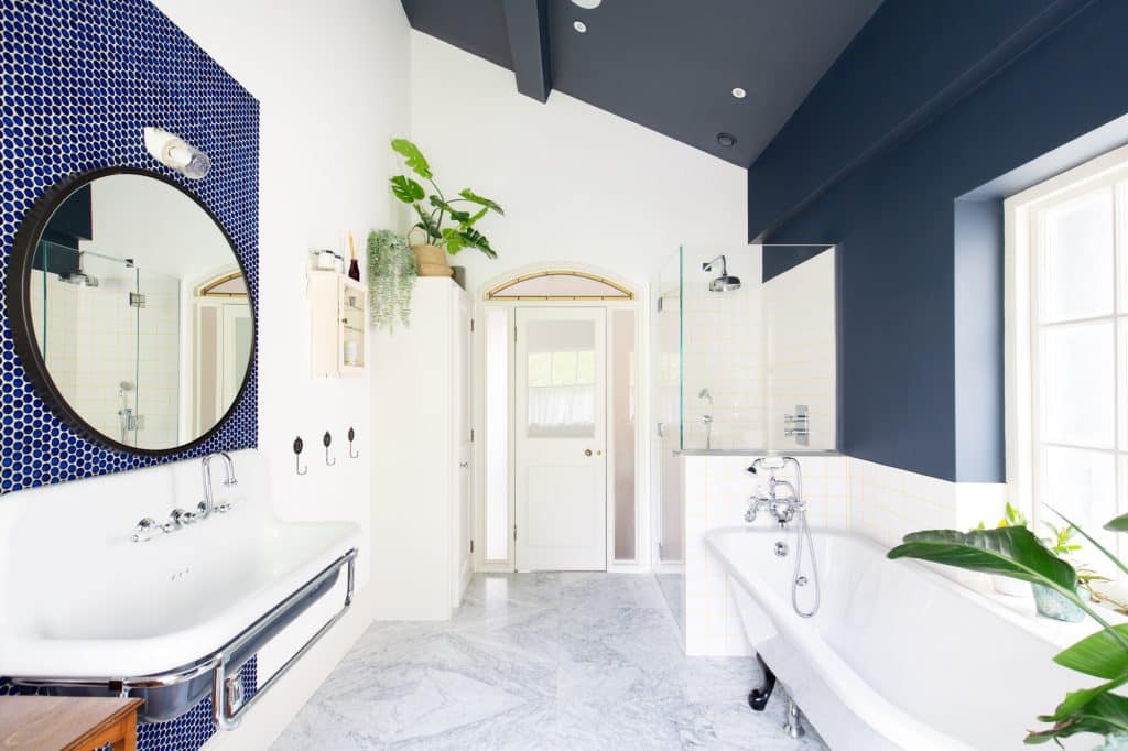 a room with a sink and a mirror