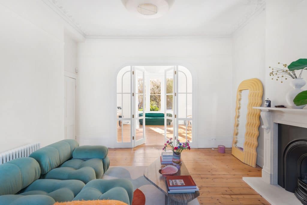 a living room filled with furniture and a fireplace