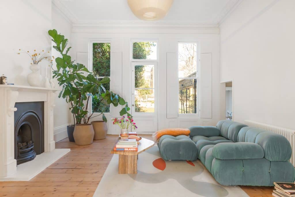 a living room filled with furniture and a fire place