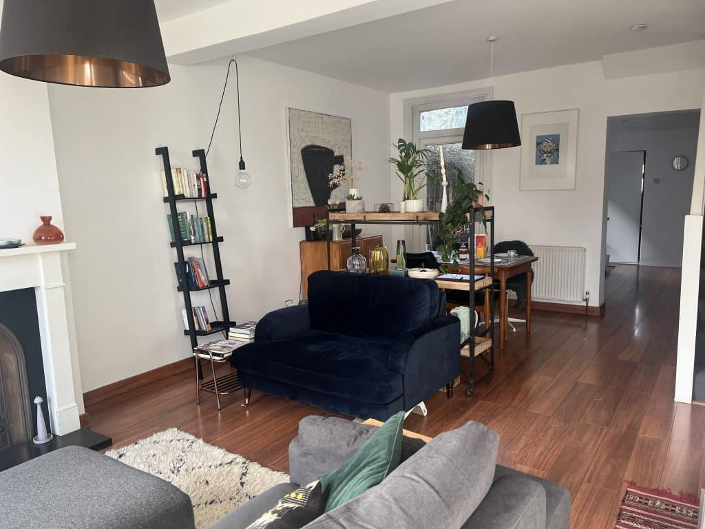a living room filled with furniture and a tv