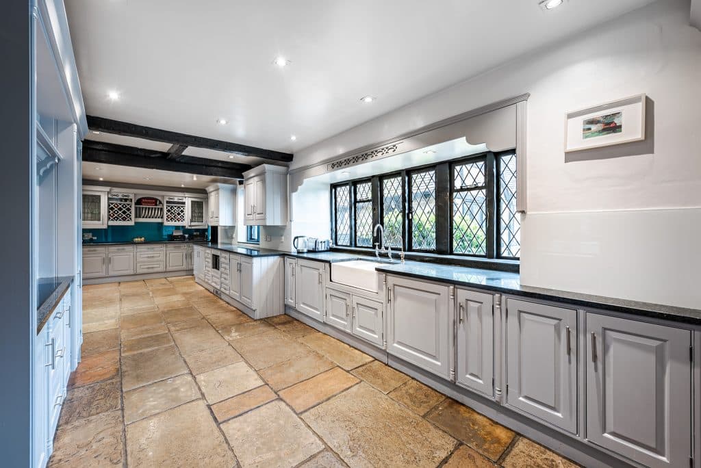 a kitchen with a tile floor