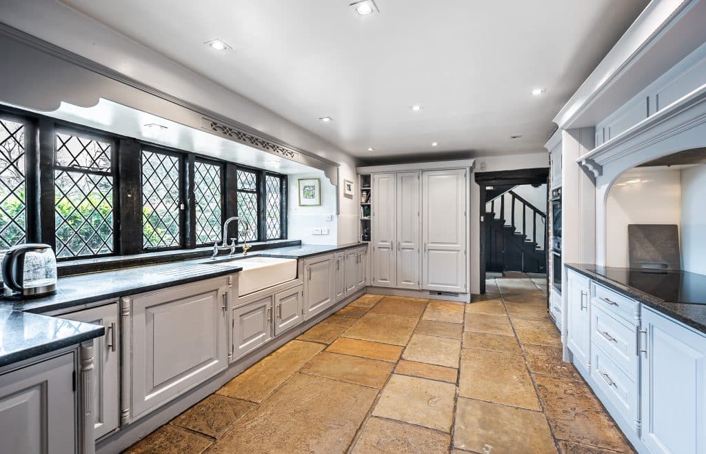 a kitchen with a tiled floor