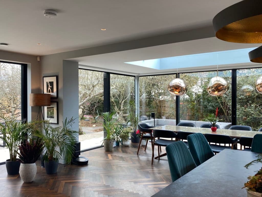 a living room filled with furniture and a large window
