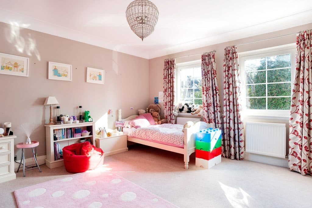 a living room filled with furniture and a large window