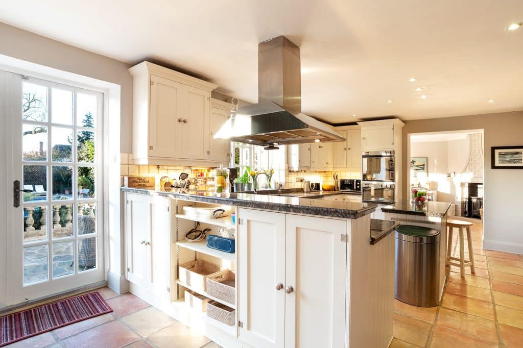 a kitchen with an island in the middle of a room