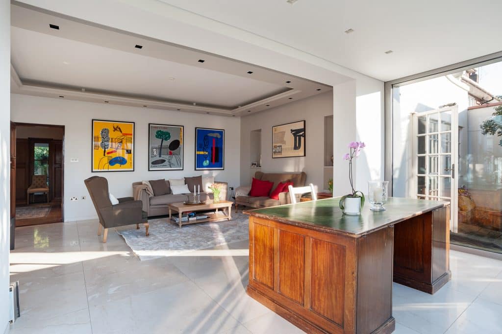 a living room filled with furniture and a large window