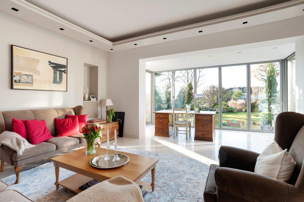 a living room filled with furniture and a fire place