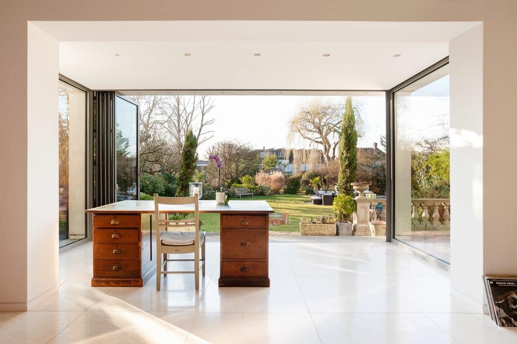 a room filled with furniture and a large window