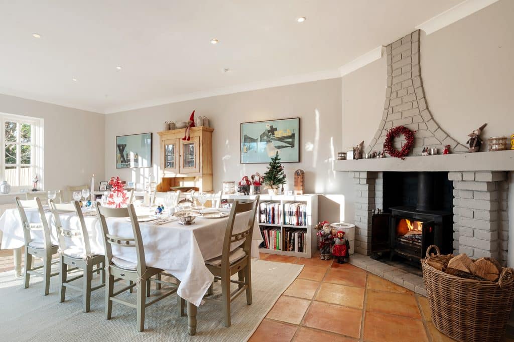 a living room filled with furniture and a fire place