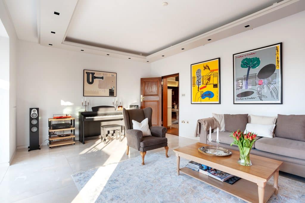a living room filled with furniture and a flat screen tv