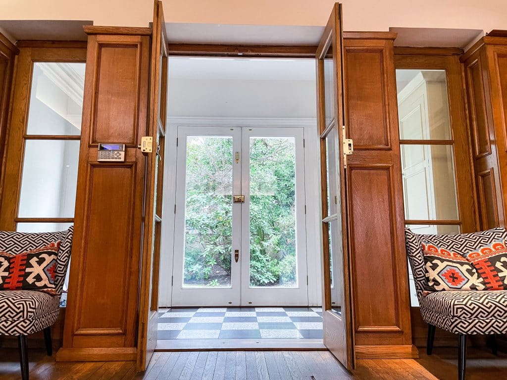 PARK LODGE6. Entrance-hall-oak-panelling-large-glass-doors-filming-location-hire-lodge-London