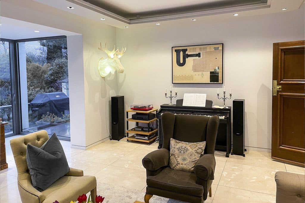 a living room filled with furniture and a flat screen tv