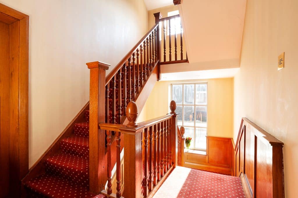 PARK LODGE7. Staircase-bannister-Art Deco-oak-panel-sunlight-windows-filming-location-hire-lodge-London