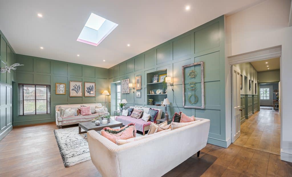 a living room filled with furniture and a large window