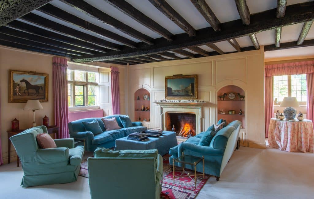 a living room filled with furniture and a fire place